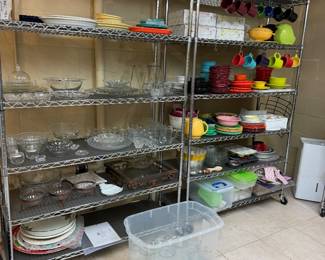 Fiesta plates and platters in a variety of colors, platters, and glass jars