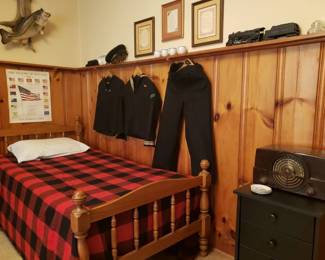 On the twin size bed is a pendleton wool blanket