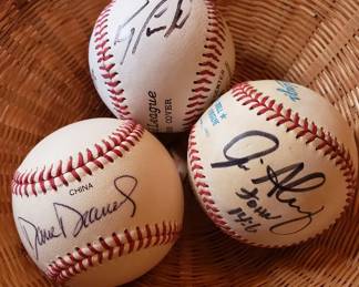 Baseballs signed by MLB players Dravecky, Alou, and Cespedes