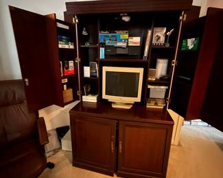 Computer armoire opened at the top. Bottom also opens and has a locking file cabinet 