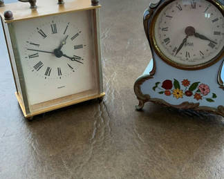 Lot 31: Brass rectangular quartz clock and blue floral mantel clock
