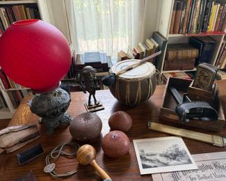 Library-oil lamp, slag rock, carved gourds, drum, stereo scope,
