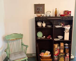 Dining Room-bookcase, green rocking chair, tins