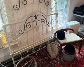 Upstairs Bedroom 2-Ornate iron & brass bed frame, vanity bench, baskets