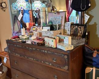 E dresser mirror, stained glass lamp, luggage, perfume