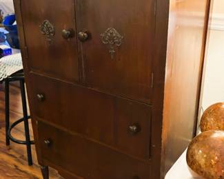 E cabinet with doors drawers, full of animal figurines