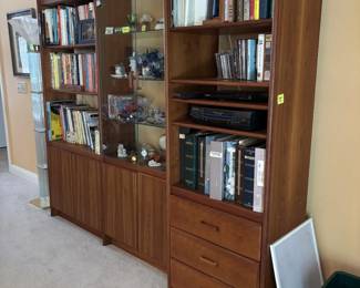Vintage teak midcentury modern 3-bay wall unit.  Created by Josef Otmar in the Danish Style. Includes close door base cabinets and glass-front display section.
