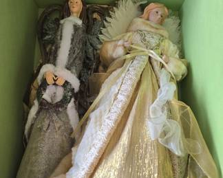 Christmas angels tree topper features a gold metallic dress with white faux fur trim and wings