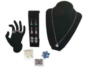Lot 5: Assorted jewelry collection: rings, earrings, and pendant necklace