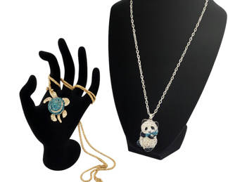 Lot 42: Besty Johnson gold-tone animal pendants: turtle and panda