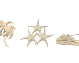 Lot 40: Betsy Johnson earrings with gold-tone palm tree, starfish, and lighthouse pins