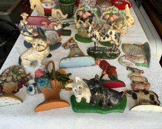 Really nice variety of Antique cast iron door stops.
