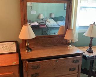 Antique chest of drawers with large mirror.