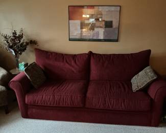 Dark red overstuffed sofa