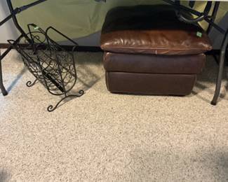 Black metal magazine rack and leather ottoman