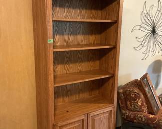 Oak shelf with storage cabinet on bottom