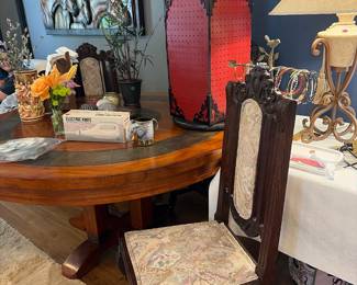 4 dining chairs that accompany round mahogany and slate table. You have to see it to believe it.