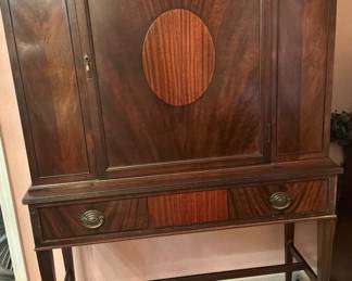 Swedish art deco cabinet distinct flamed Birchwood finish an a Central oval design
