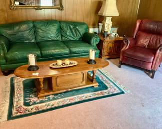Green leather couch and maroon leather chair