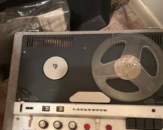Vintage Lafayette RK – 650 stereo reel to reel deck featuring a two-tone silver and black control panel