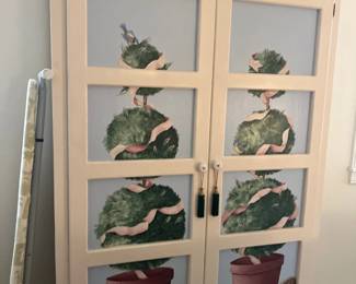 Painted armoire with decorative cutouts 