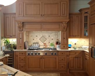 Traditional Hardwood Kitchen Cabinetry Suite with Decorative Corbels