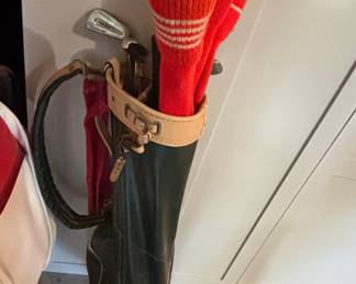 Vintage Golf Bag with Assorted Clubs and Knit Headcovers
