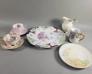 Lot 310  Group of porcelain teacups, saucers, pitcher,