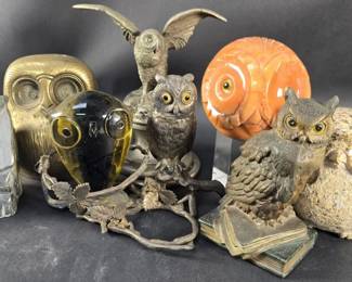 Lot 506  Group of owl figurines, a silver plate, a stone