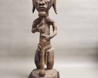 Lot 216  Vintage African carved wood figurine