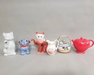 Lot 391  Group of porcelain and ceramic teapots, cream a