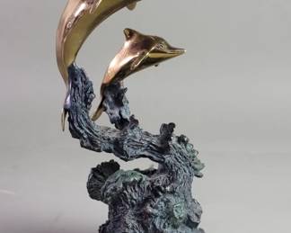 Lot 265  Signed Don Parker bronze and brass dolphins