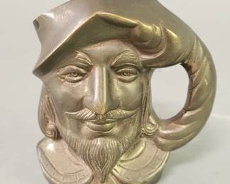 Lot 523  Vintage brass pirate head figural mug