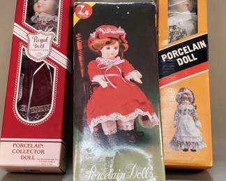 Lot 306  Group of porcelain dolls in original boxes