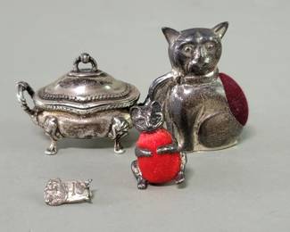 059  Lot 427  Pair of sterling silver cat pin cushions,