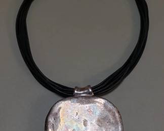 068  Lot 74  BatAmi sterling silver pendant and leather