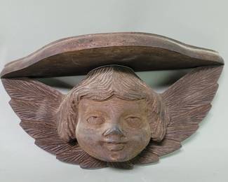 Lot 204  Vintage carved wood cherub wall bracket