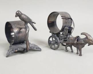 Lot 554  Pair of silver plate figurial napkin rings