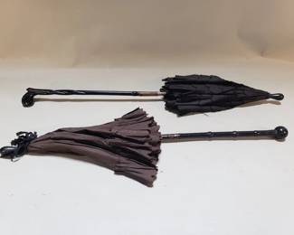 Lot 36  Pair of black Victorian petite parasols with