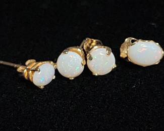 022  Lot 339h  Four 14k gold and opal stud earrings