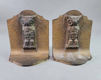 Lot 548  Vintage brass tone cast iron owl bookends