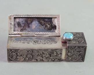 Lot 235  Circa 1940s silver compact with engraved floral