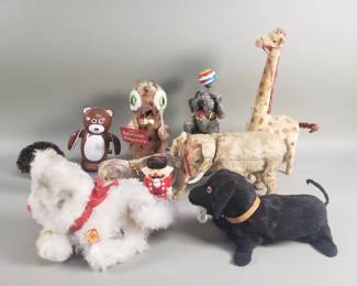 Lot 320  Group of vintage wind up toys