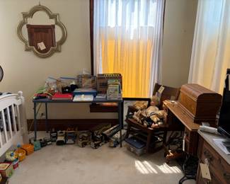 treadle sewing machine, books, dolls, toys