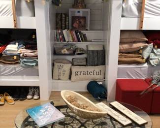 Books, decorative pillows, oval table & area rug 