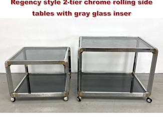 Lot 486 Pair of 1970s Modern Hollywood Regency style 2tier chrome rolling side tables with gray glass inser