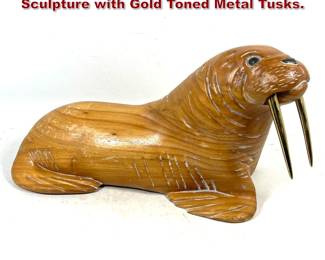 Lot 190 Large Hand Carved Wooden Walrus Sculpture with Gold Toned Metal Tusks.