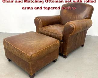 Lot 525 Crate and Barrel 2pc Leather Club Chair and Matching Ottoman set with rolled arms and tapered dark w