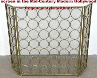 Lot 413 3 panel gold toned metal fireplace screen in the MidCentury Modern Hollywood Regency style with int