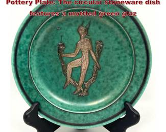 Lot 87 Swedish GUSTAVSBERG Argenta Pottery Plate. The circular stoneware dish features a mottled green glaz